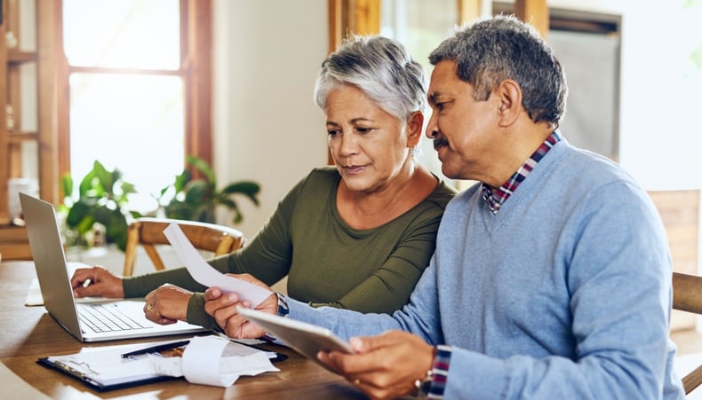 Eldery couple discussing finances